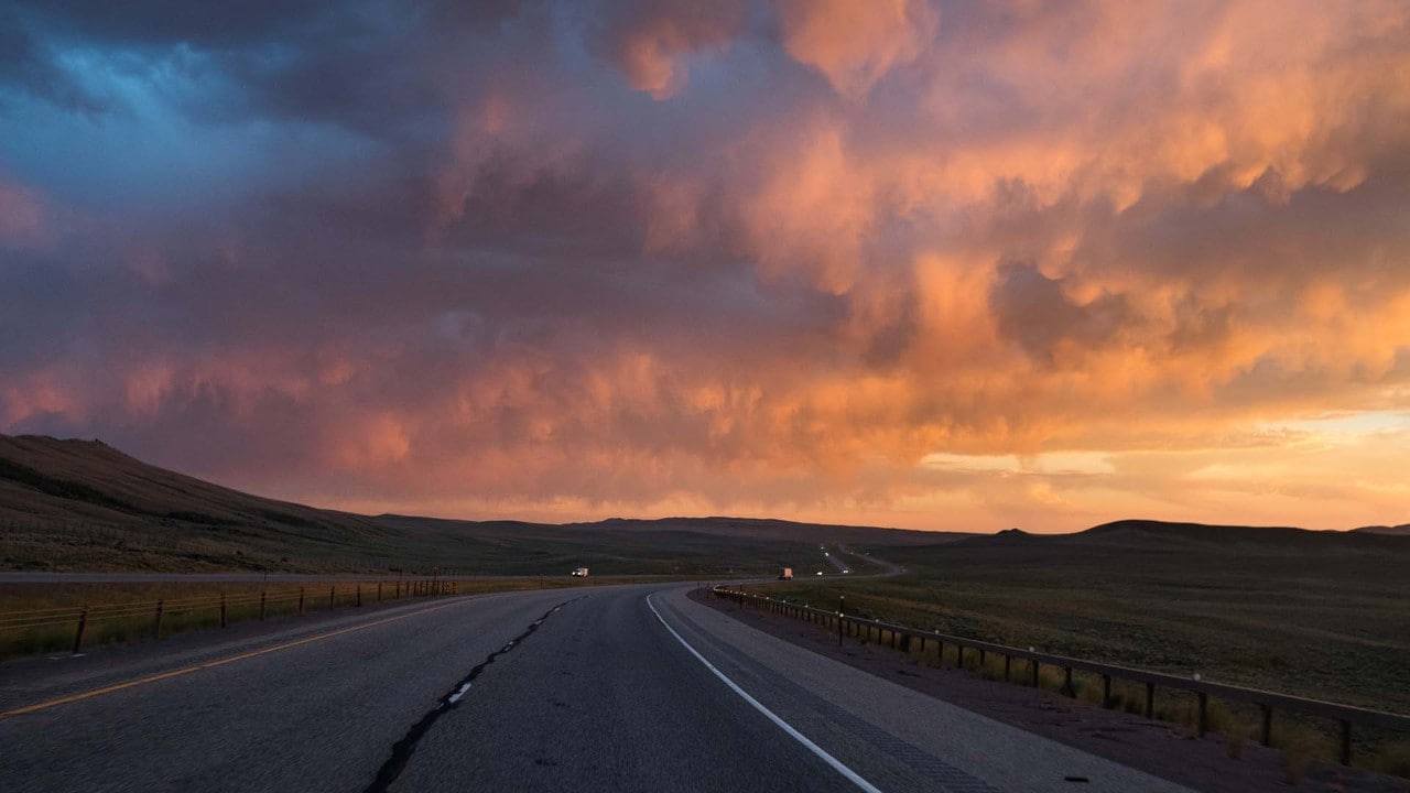 The sun sets on Interstate 80 in southern Wyoming. Afternoon thunderstorms are common during the summer.