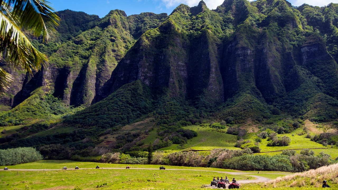 Visitors enjoy an ATV tour through Kualoa Ranch's beautiful 1,000-acre Kaʻaʻawa Valley.