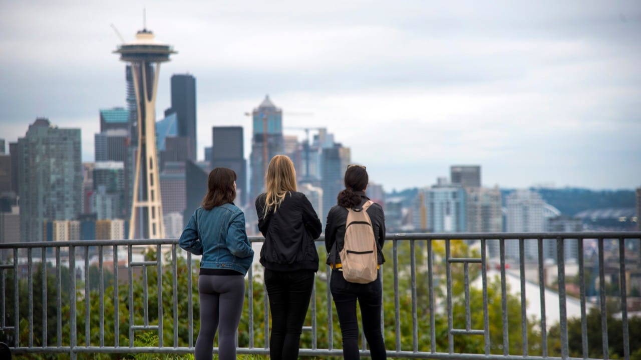 People enjoy the Seattle skyline from Kerry Park. 